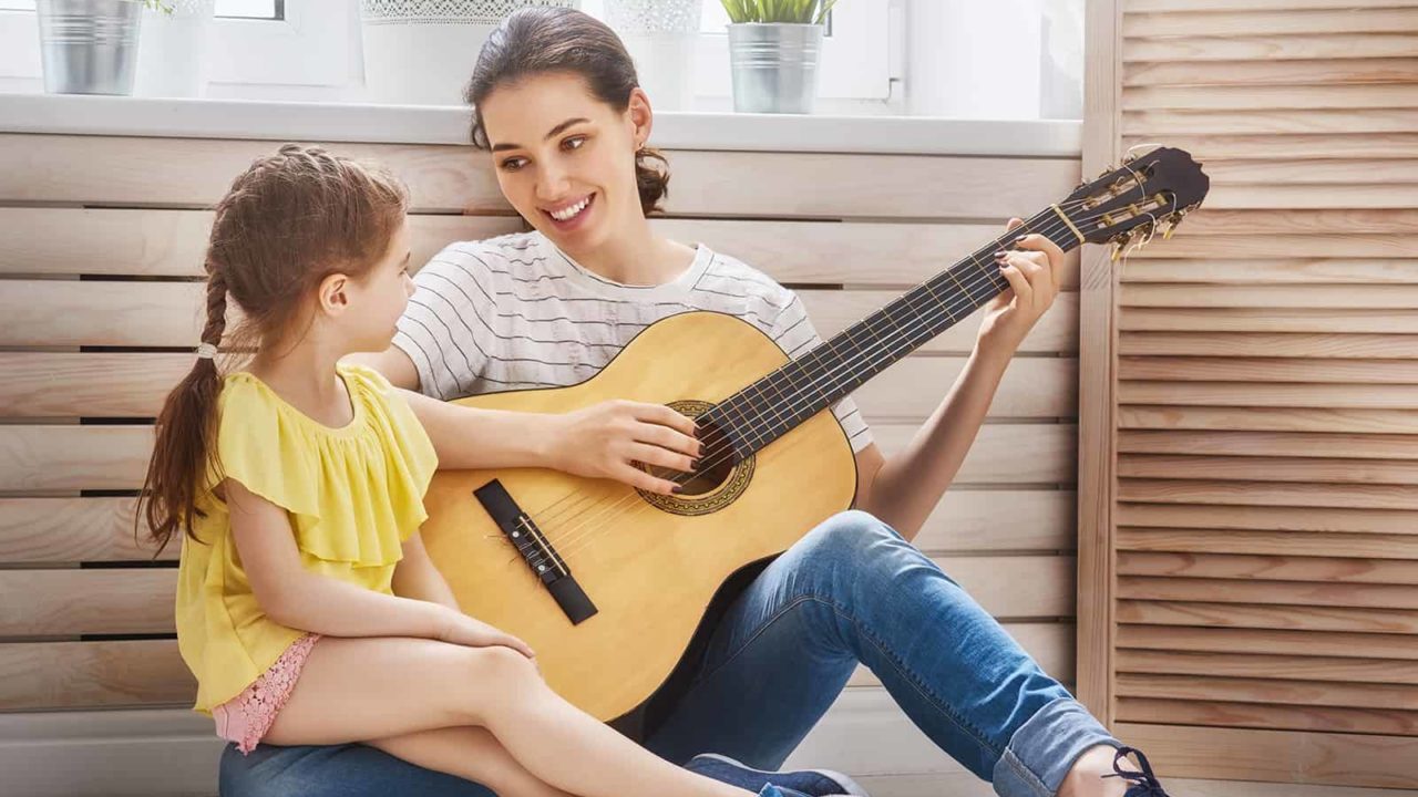 https://grooveacademy.ca/wp-content/uploads/2021/12/parent_playing_guitar-1280x720.jpg
