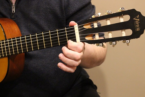 Playing high e-string first fret